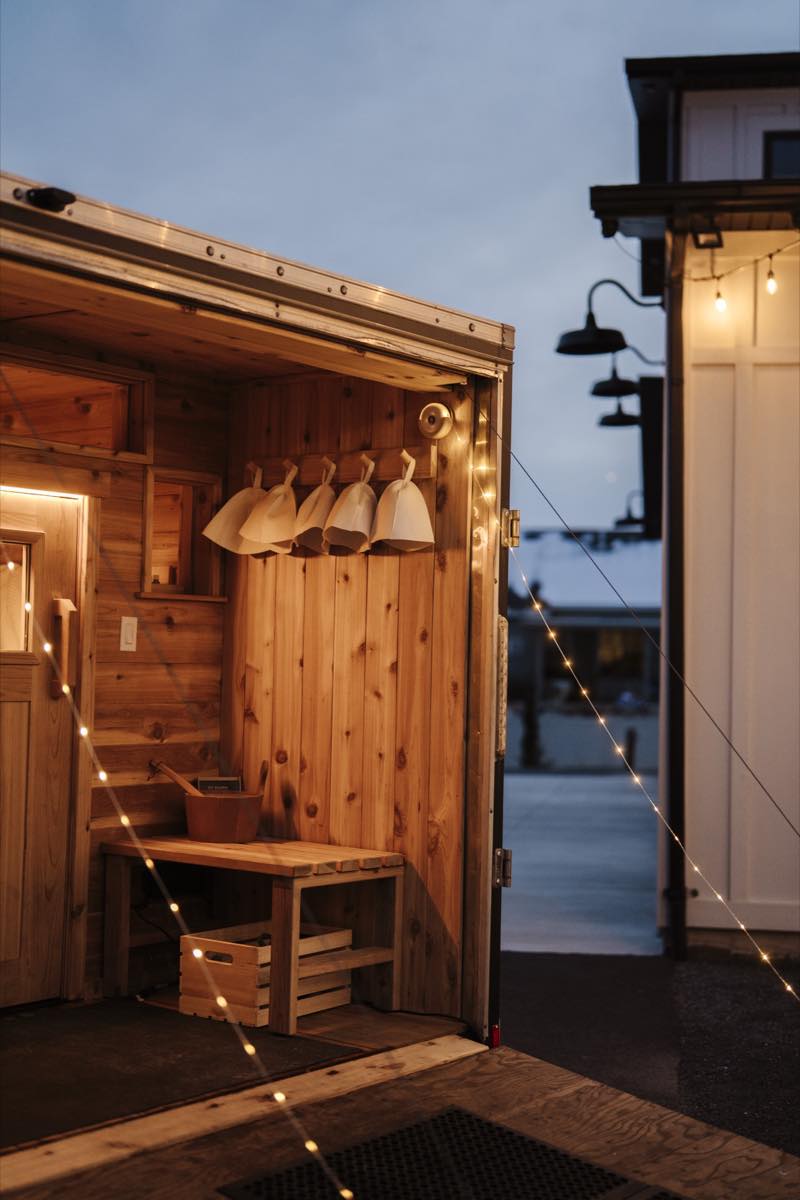 Guests relaxing outside RO Sauna between rounds